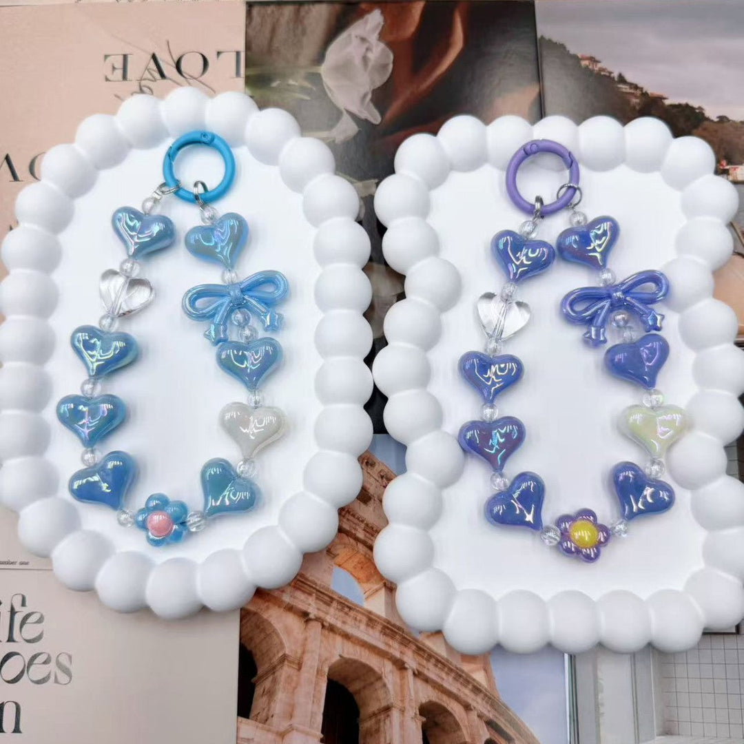 Women's colorful heart charm keychain, a vibrant iridescent bag accessory & unique gift.
