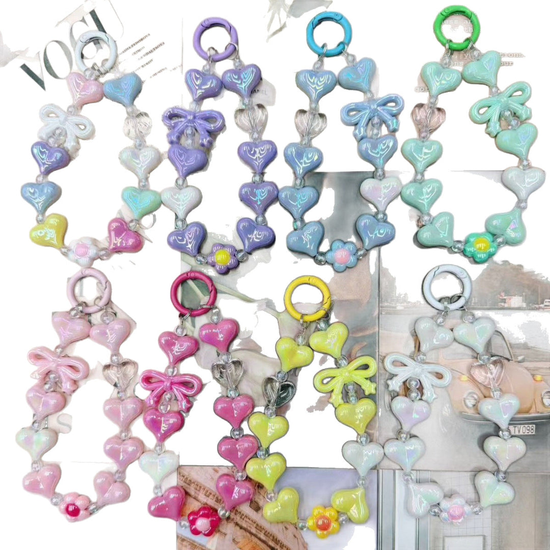 Eye-catching iridescent heart charm keychain for women, a vibrant and colorful accessory for bags.