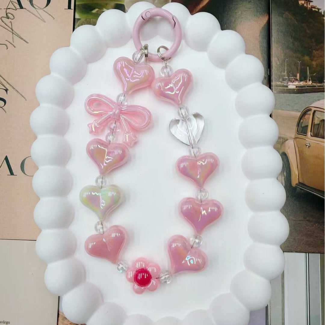 Distinctive women's heart charm keychain, vibrant and colorful iridescent design. A unique bag accessory gift.