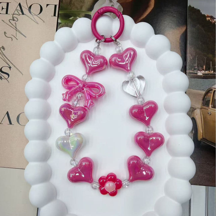 Fashionable heart charm keychain in vibrant iridescent colors. A must-have women's accessory for bags & keys.