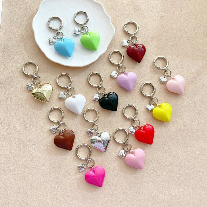 Vibrant heart-shaped charm keychain for women, stylish bag accessory.