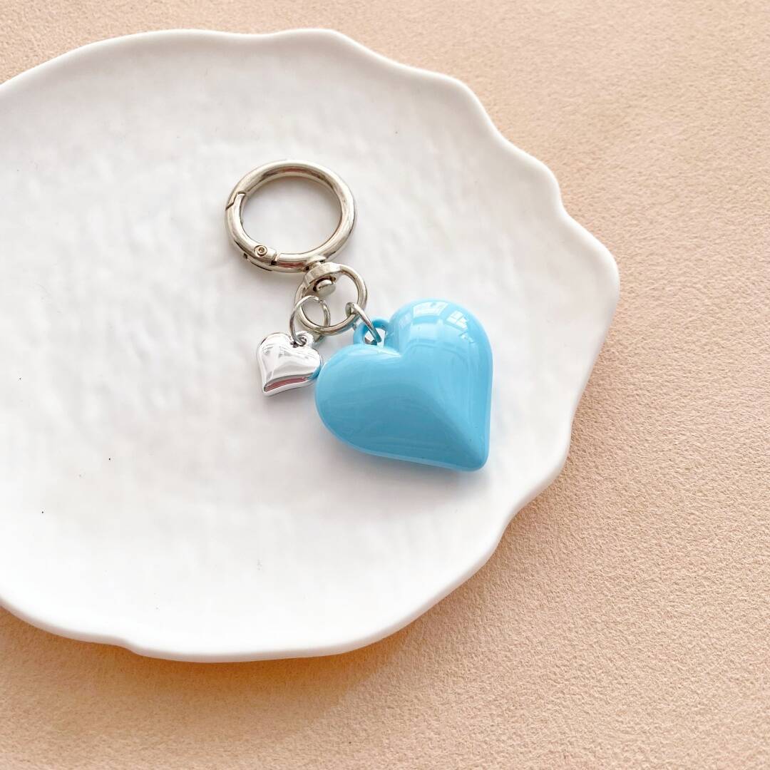 Vibrant heart charm, a stylish key holder and bag accessory for women.