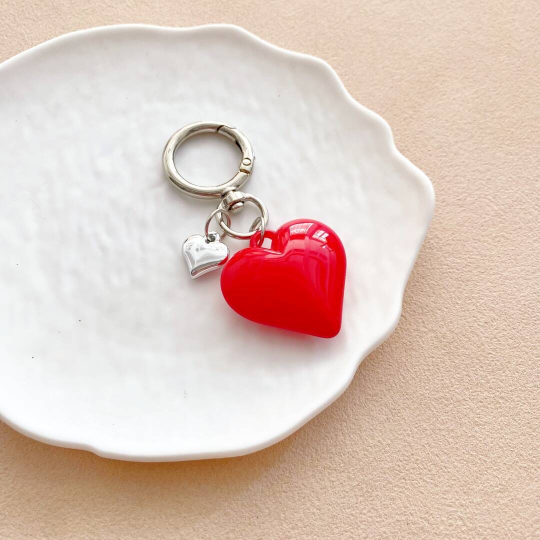 Stylish heart charm, a vibrant key holder and fashion accessory for women.