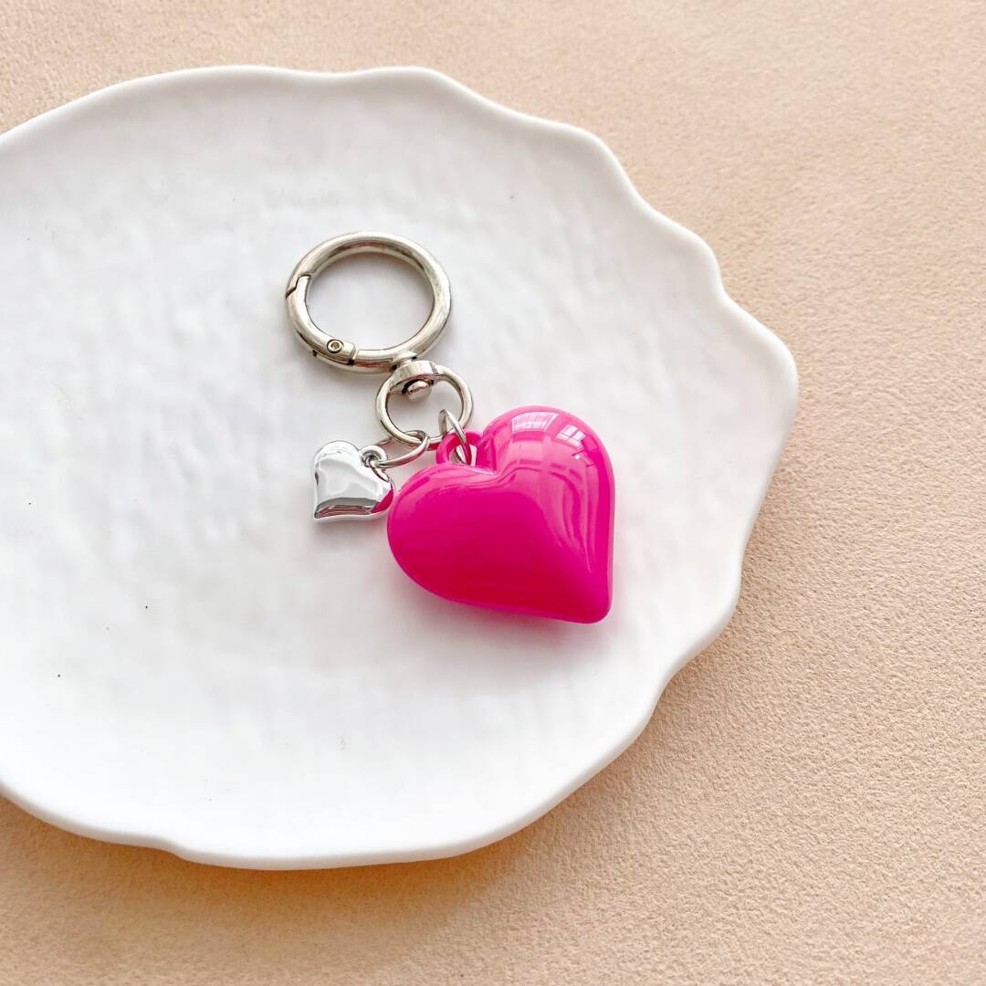 Women's vibrant heart charm, stylish key holder & trendy bag accessory.