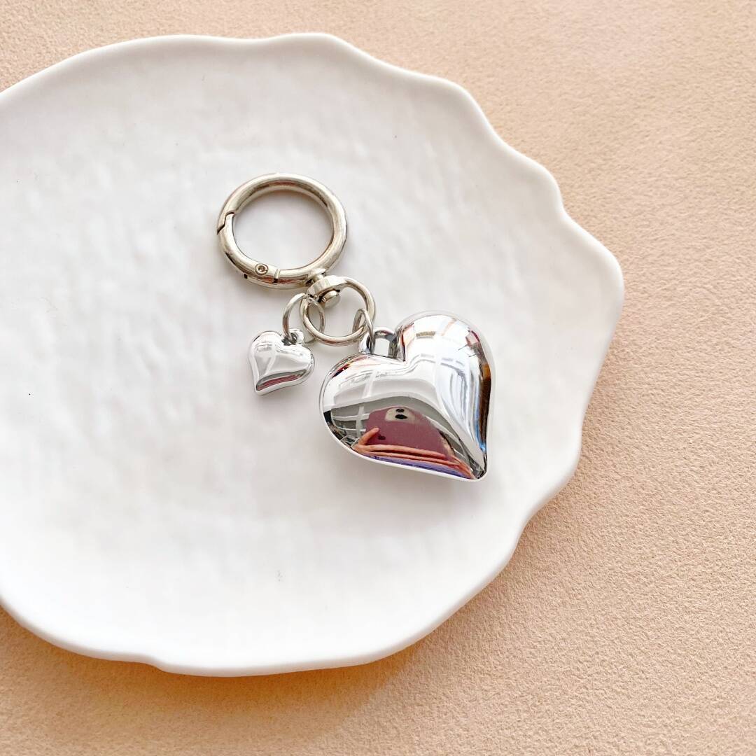 Women's elegant heart charm keychain, a colorful and stylish bag accessory.
