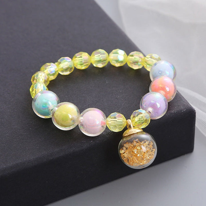 Rainbow-hued glass bead stretch bracelet, women's trendy fashion accessory. Vibrant and comfortable.
