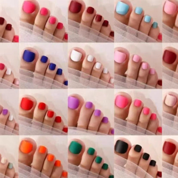 Woman applying a vibrant nail art color tip, showcasing easy DIY manicure for beautiful nail designs.