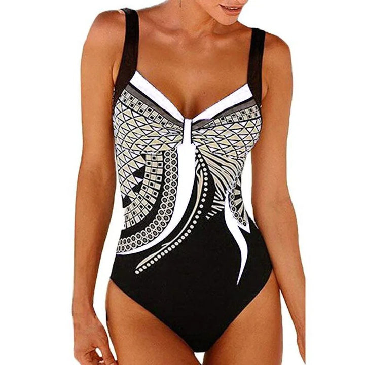 Stylish women's printed swimwear with tummy control & adjustable straps, perfect for resort fashion & summer.