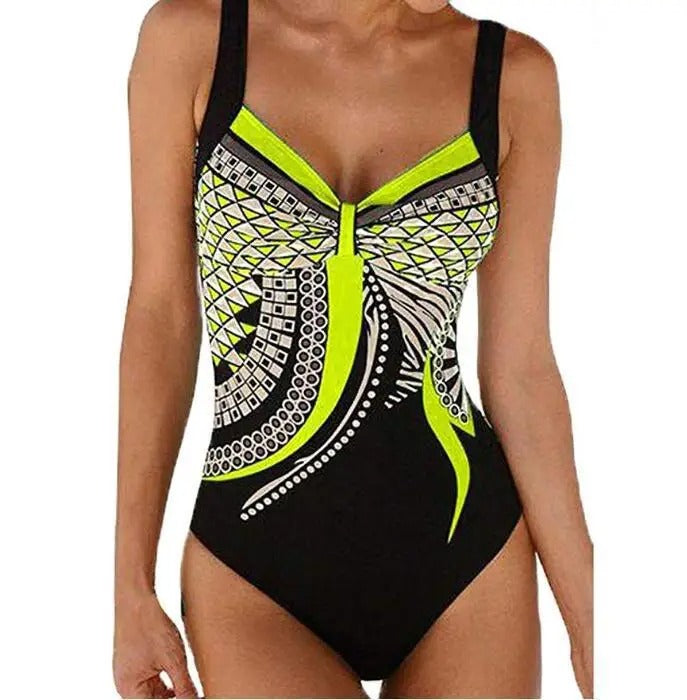 Flattering women's tummy control swimsuit with vibrant prints, ideal for a stylish and confident day at the beach.
