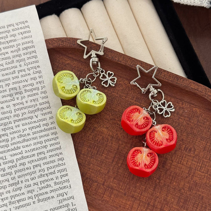 Playful red & green tomato charm for keys or bags. A unique, eye-catching novelty accessory and fun gift.