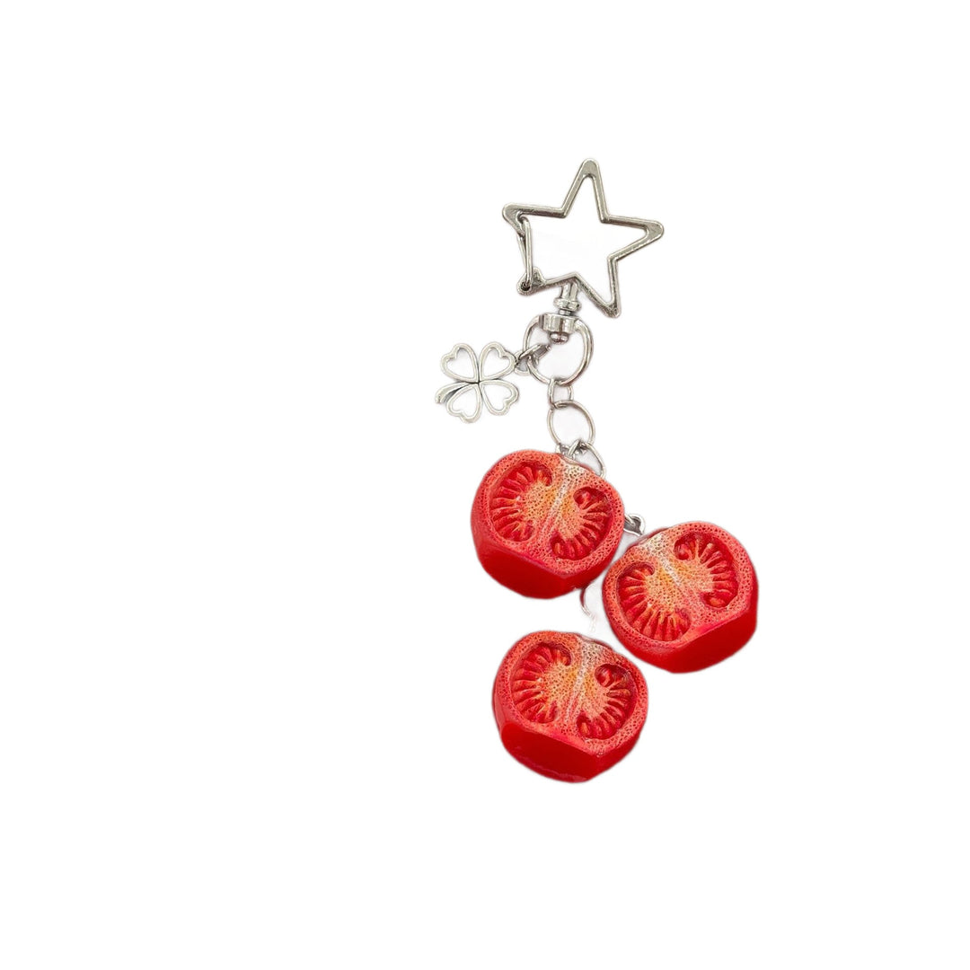 Cute tomato bag charm keychain, featuring a glossy red tomato and vibrant green leaves. A sweet accessory for keys.