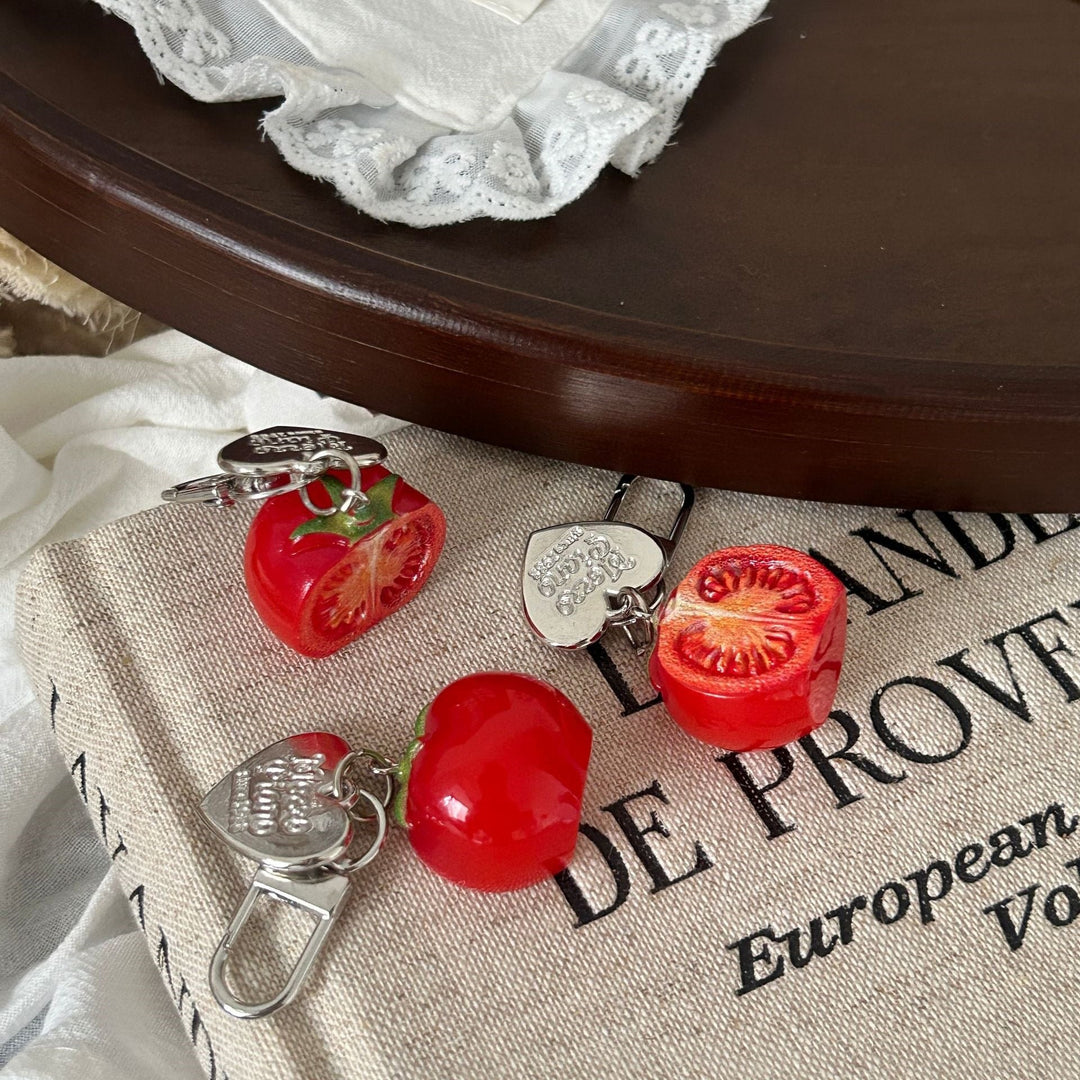 Cute red tomato keychain charm accessory. Ideal for keys, backpacks, and purses. A fun, unique bag charm.