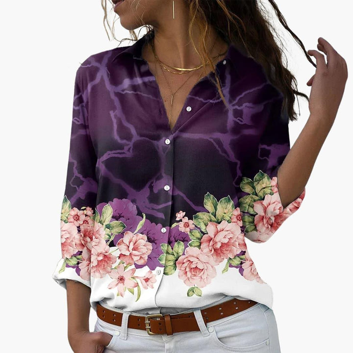 Vibrant floral short sleeve women's top, offering a comfortable relaxed fit for warm weather fashion.