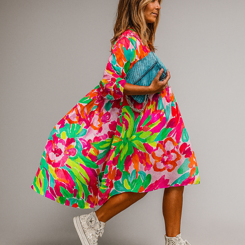Vibrant women's oversized floral print midi dress with puff sleeves. A-line style, perfect for spring/summer fashion.