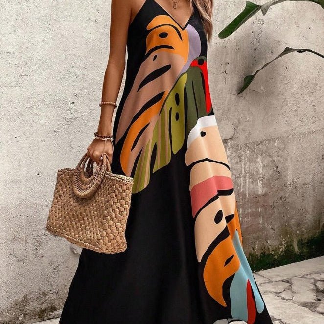Vibrant women's tropical leaf print maxi dress, perfect for summer beachwear or resort vacation style.