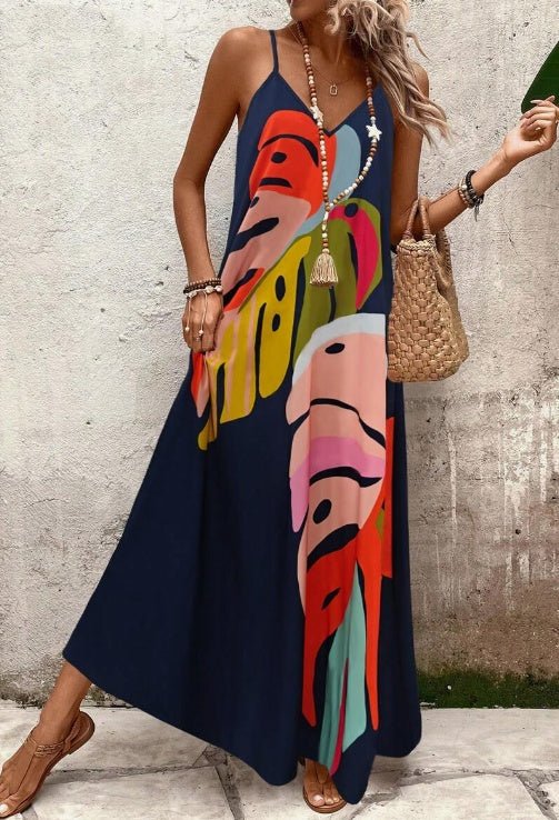 Effortless women's tropical leaf maxi dress. Vibrant print, sleeveless, perfect for summer, beach, resort.
