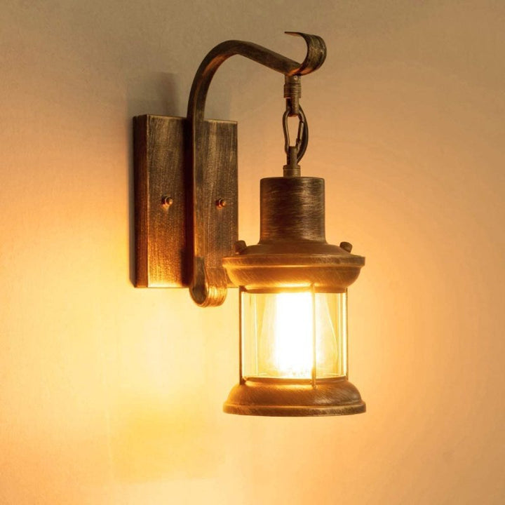 Industrial metal wall sconce with vintage appeal for outdoor patio lighting.