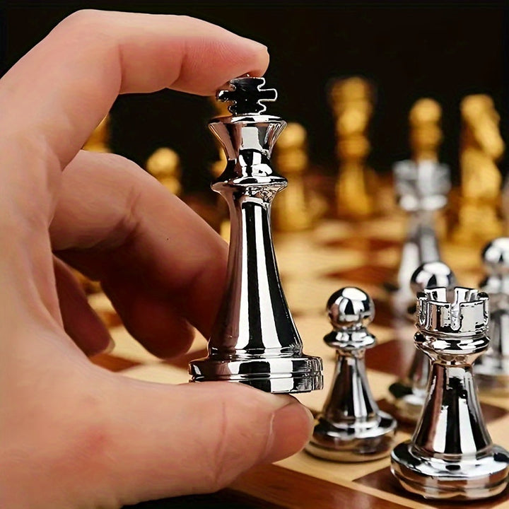 Foldable wooden travel chess set with elegant metal pieces. Perfect for strategy games on the go.