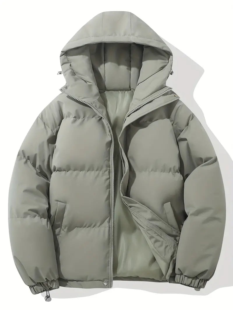 Durable women's quilted puffer jacket, featuring a protective hood. Excellent warm outerwear for cold conditions.