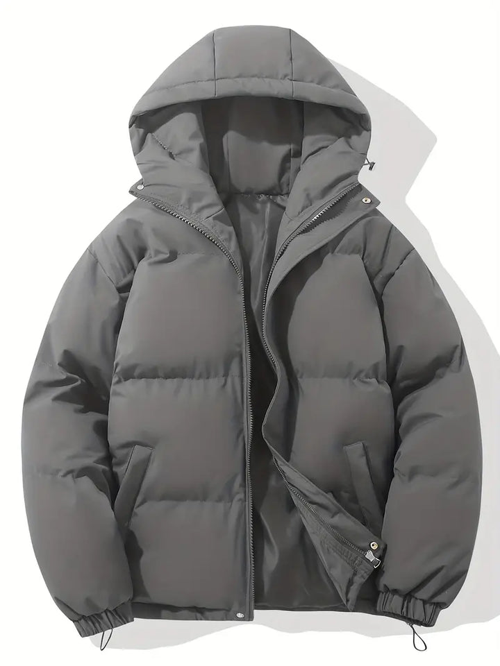 Modern women's hooded quilted puffer jacket. Provides superior warmth and fashion for chilly winter days.