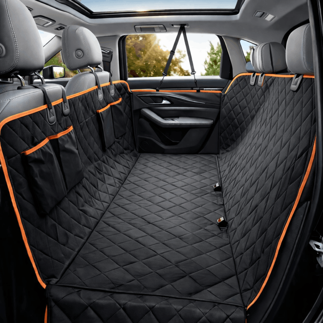 Waterproof dog car seat cover with side flaps & pockets for back seat protection during pet travel. Universal fit.