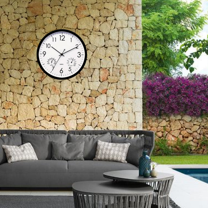 Stylish outdoor clock & temperature gauge for gardens. Weatherproof design, perfect for patio or backyard home decor.
