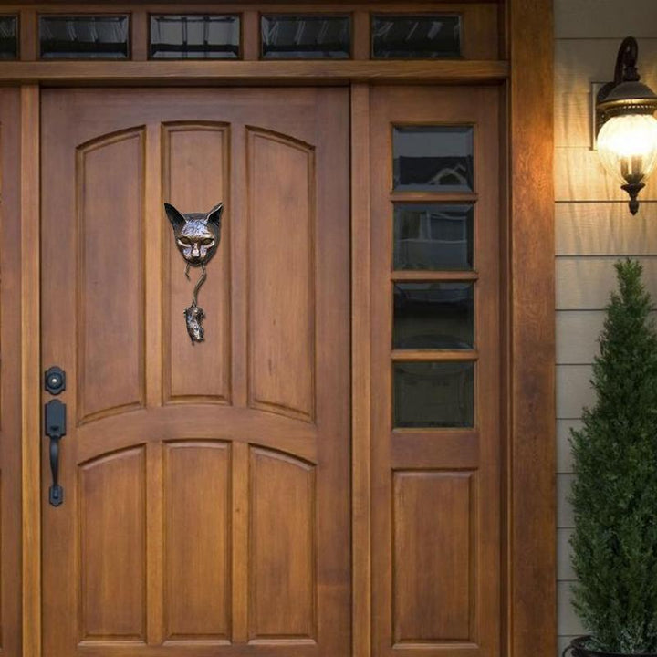 Decorative cat and mouse door knocker. A charming, animal-themed home accent for your entryway.