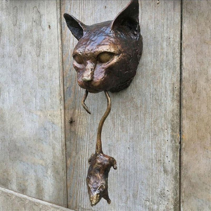 Whimsical cat and mouse door knocker. A unique, animal-themed accent for any front door or entryway.