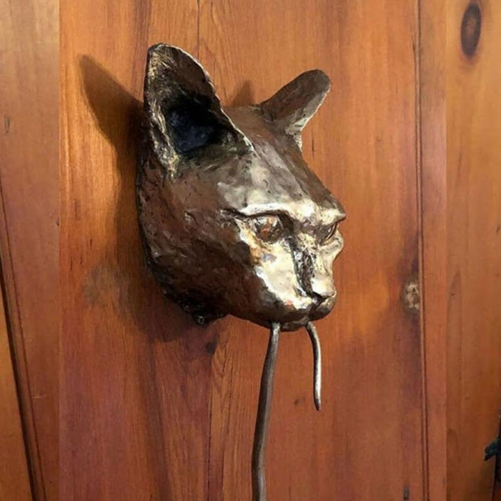 Artistic cat & mouse door knocker in resin. A decorative, animal-themed home accent for entryway walls.