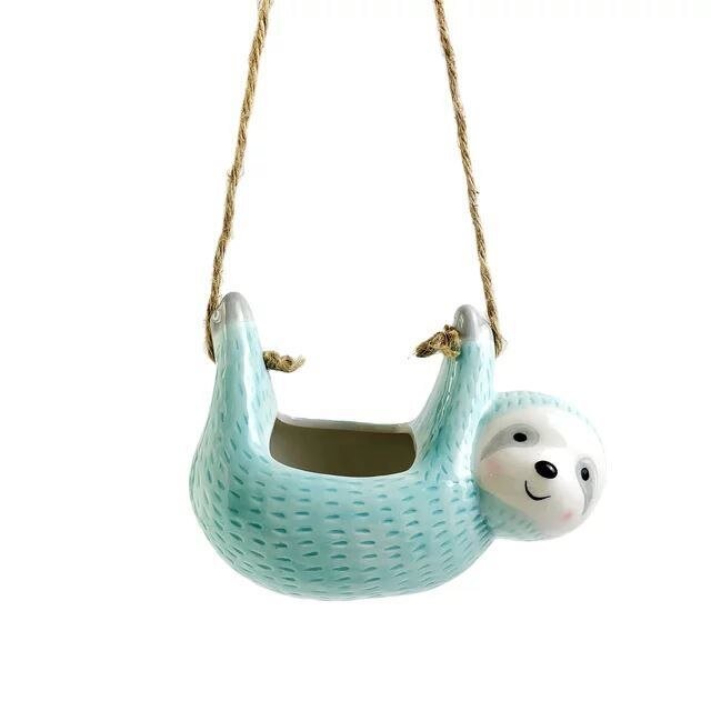 Adorable ceramic sloth hanging planter, a unique indoor flowerpot for plant lovers. Great home decor gift.