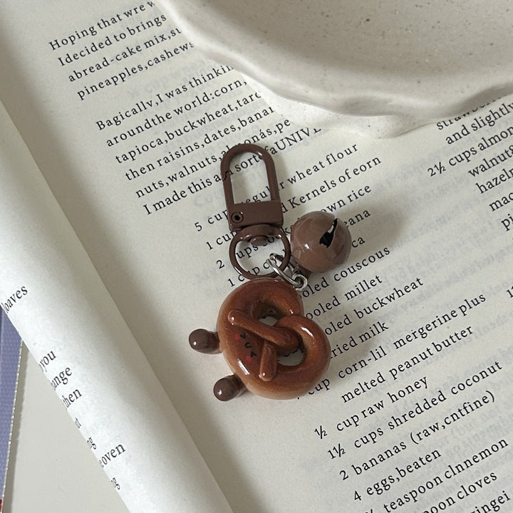 Vibrant donut charm pendant, an eye-catching, playful accessory for necklaces, keychains, or bag decoration.
