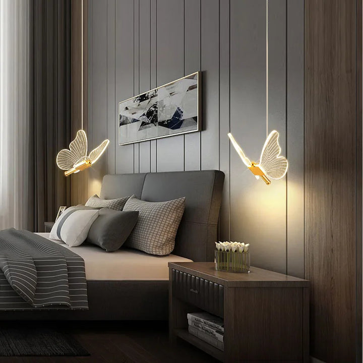 Glass and metal LED butterfly lamp, an adjustable height pendant light ideal for kids' room decor and ambient lighting.