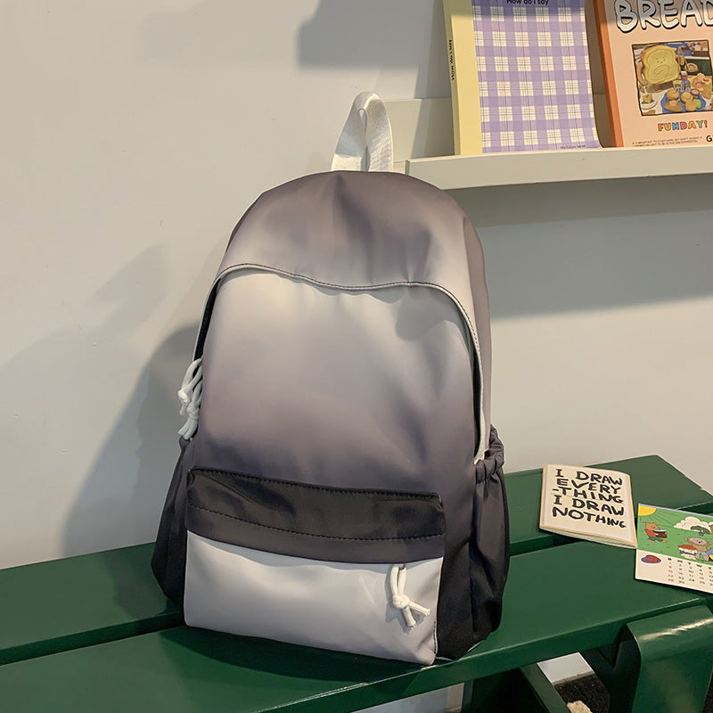 Unisex whimsical character backpack in black for school, travel & everyday adventures. Durable kids' bag.