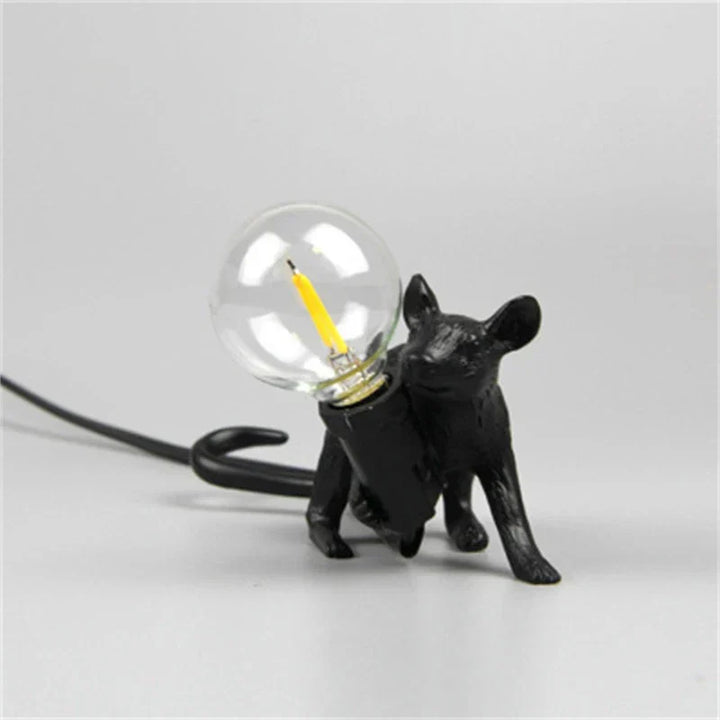 Resin rat novelty lamp with an exposed bulb, offering quirky charm and ambient lighting for desks.