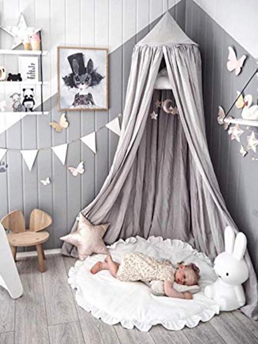 Dreamy baby nursery bed canopy, perfect as a play tent or cozy reading nook in a kids room.