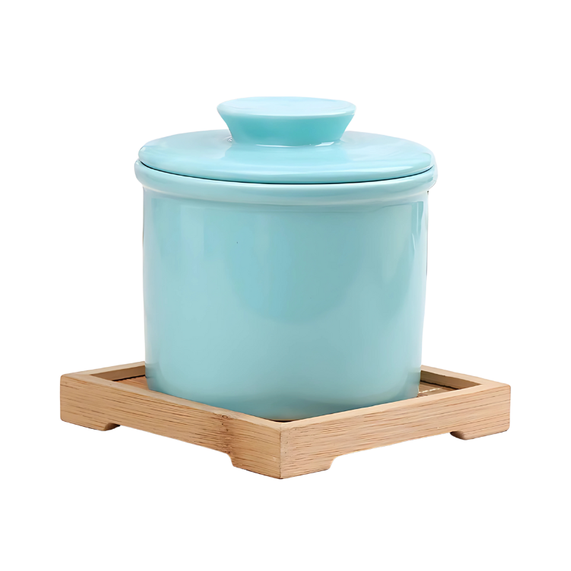 Round ceramic butter dish with water-sealed base, perfect for storing and serving fresh, spreadable butter.