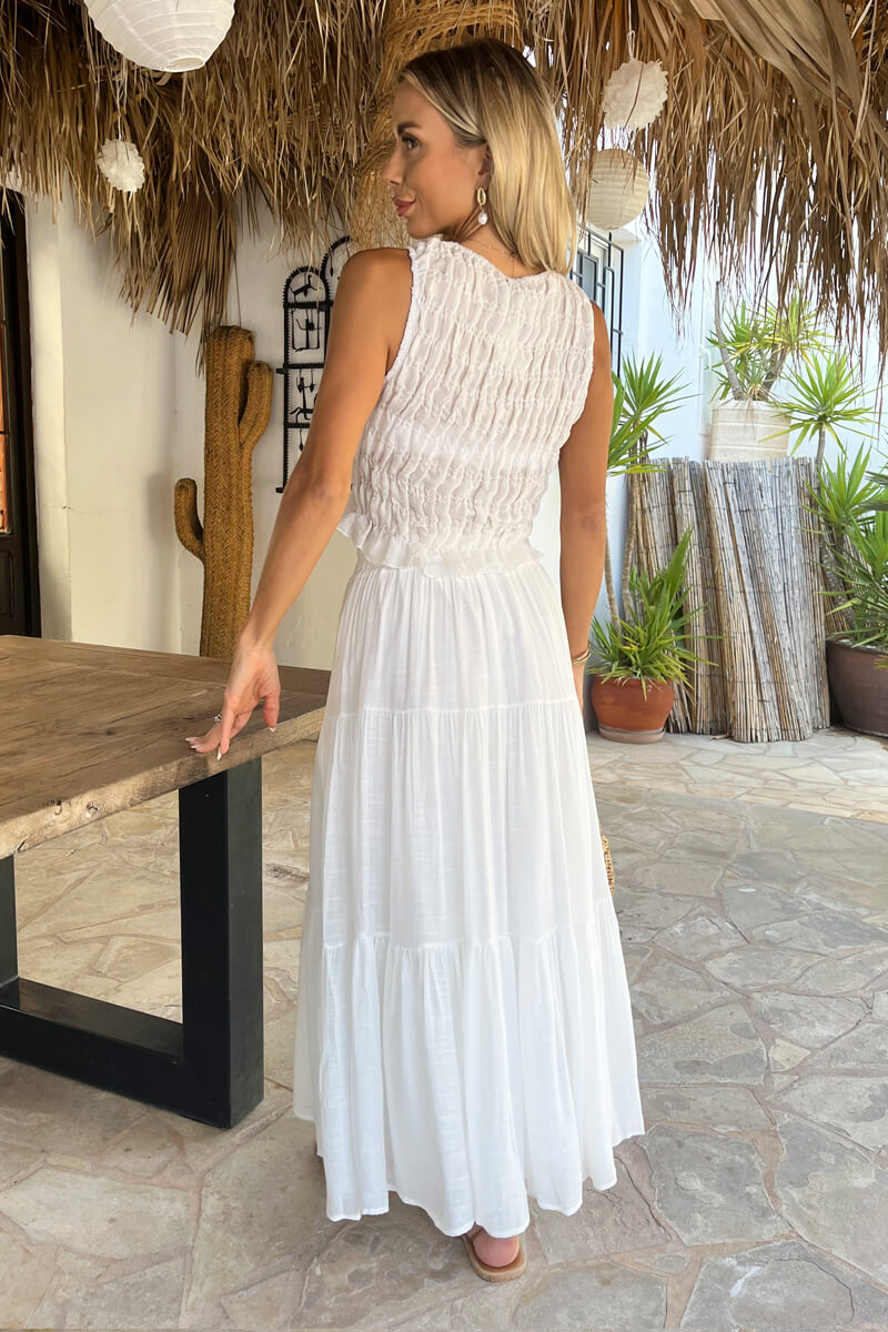 Stylish women's white tiered midi skirt, ideal for summer fashion, vacation wear, or casual elegant outfits.