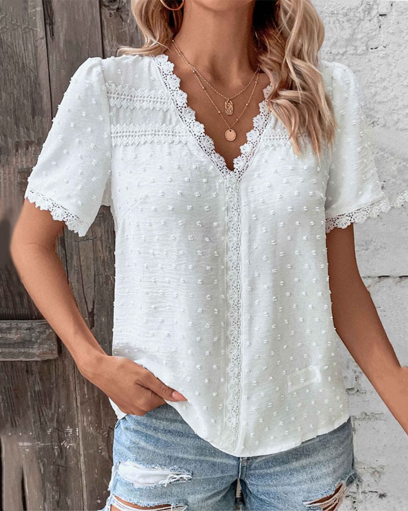 Breathable short sleeve V-neck top for women. Features elegant lace trim, ideal for versatile summer outfits.