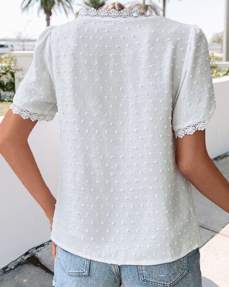 Breathable V-neck summer top for women with chic lace trim. Perfect short-sleeve white blouse for casual or elegant wear.