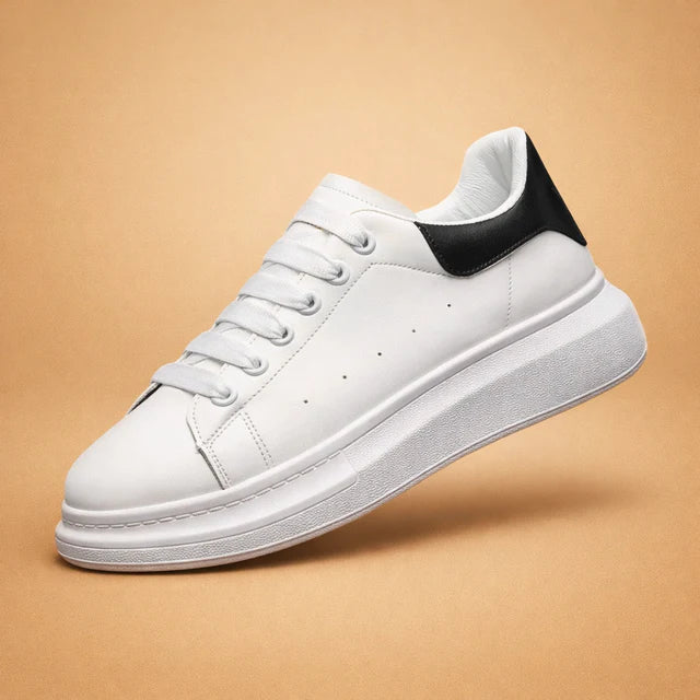 Modern white ladies' platform sneakers. Versatile and comfortable for casual wear and fashion-forward everyday style.
