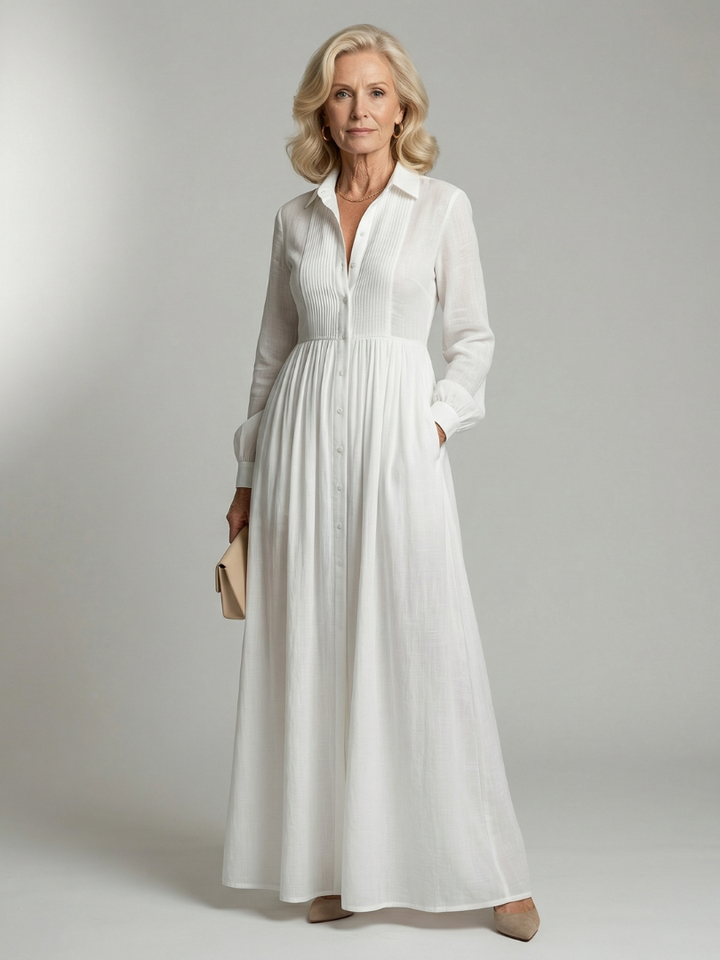 White women's soft flowing long sleeve maxi dress with button front & gathered waist. Perfect for casual summer/spring wear.