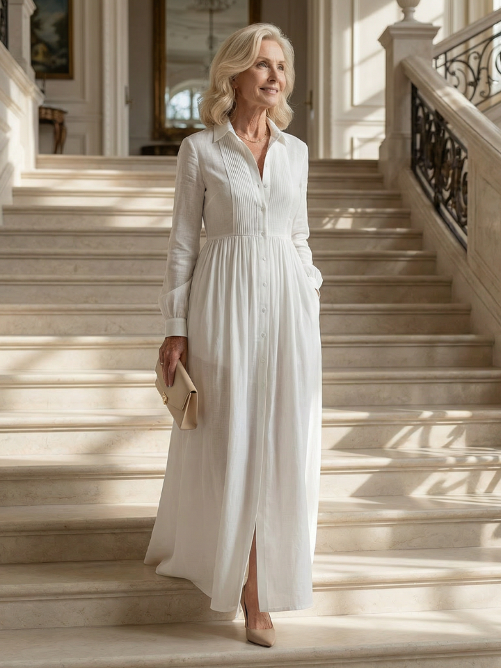 Soft white women's long sleeve maxi dress. Button front, gathered waist. A comfortable & versatile flowing dress for spring/summer.