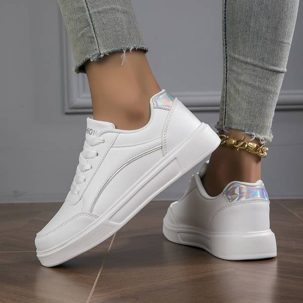 Effortless style: women's white metallic accent trainers, comfortable and chic for any occasion.
