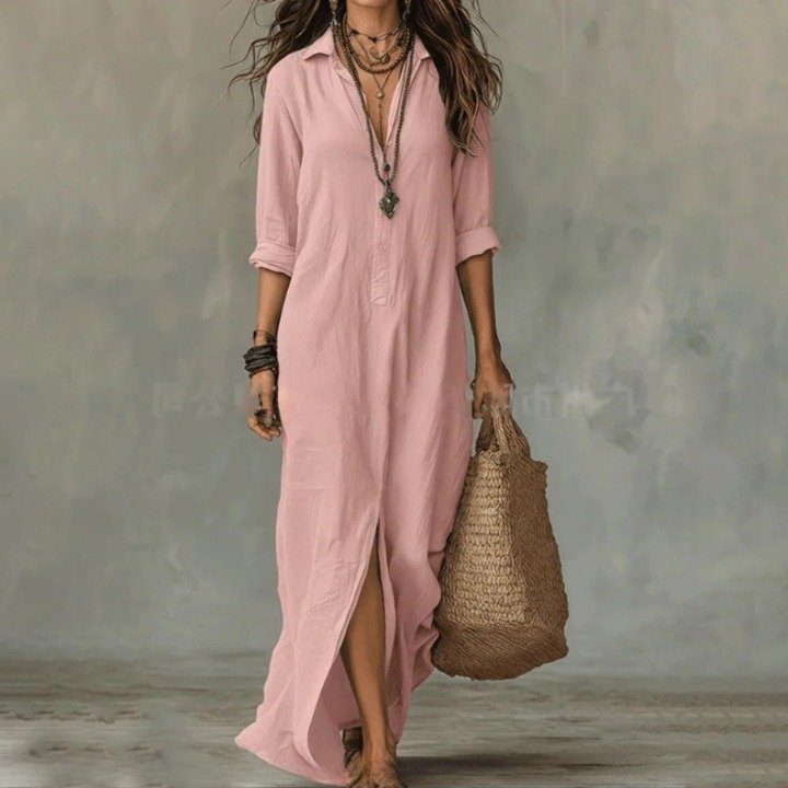 Woman in a casual pink three-quarter sleeve maxi shirt dress with a button front, perfect for summer everyday wear.