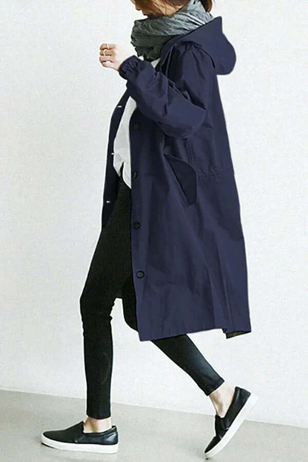 Full shot of a women's all-weather rain cape, showcasing its practical yet stylish design.