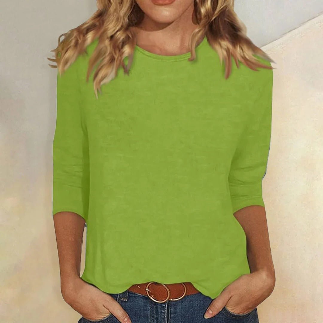 Woman enjoying a casual outing in a fashionable relaxed fit 3/4 sleeve crew neck top, embodying everyday comfort.