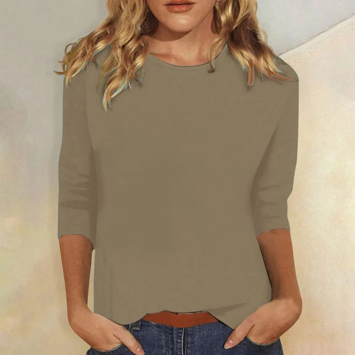Vibrant colored women's relaxed fit 3/4 sleeve crew neck top, a comfortable and versatile basic for any wardrobe.