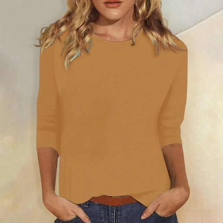 Close-up of the classic crew neck and relaxed fit on a women's comfortable 3/4 sleeve top, perfect for casual wear.