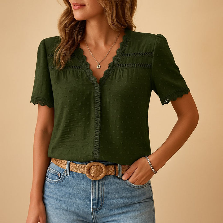 Casual women's V-neck top featuring subtle textured dot design & pretty lace details on short sleeves.