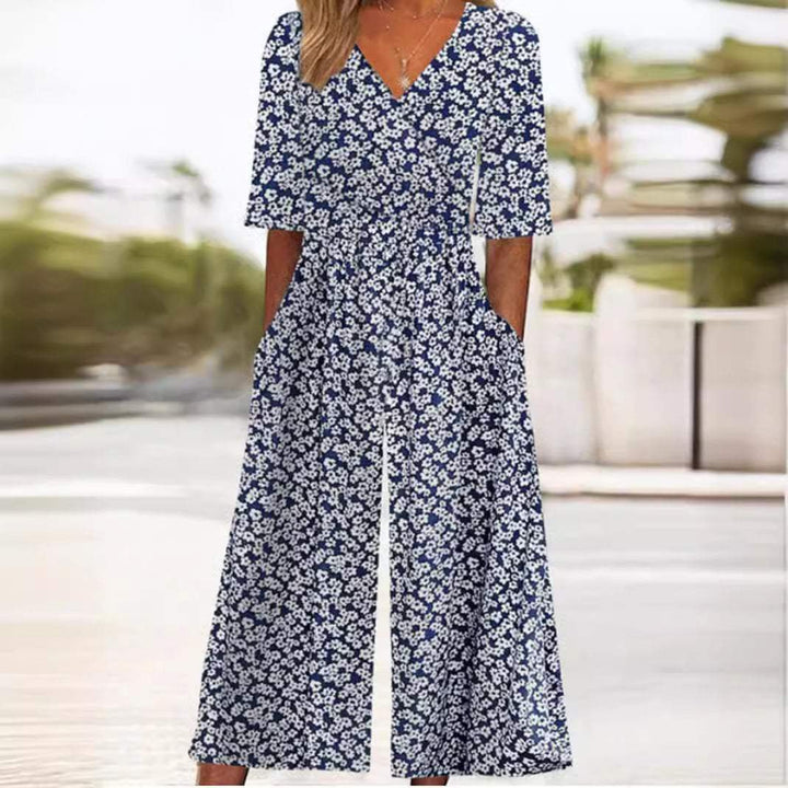 Model enjoying a vacation day in a comfortable boho floral V-neck wide-leg jumpsuit, ideal summer fashion.